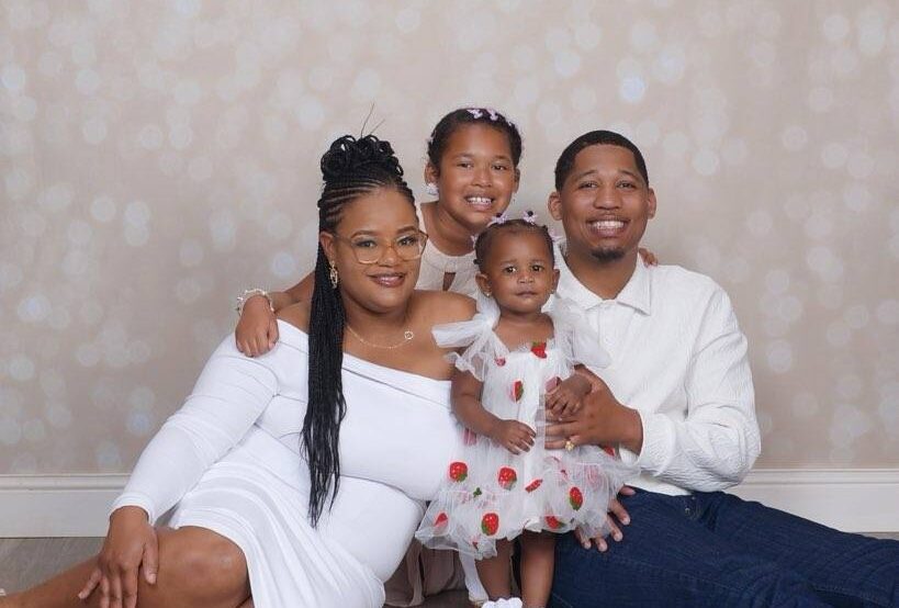 family smiling for professional photo
