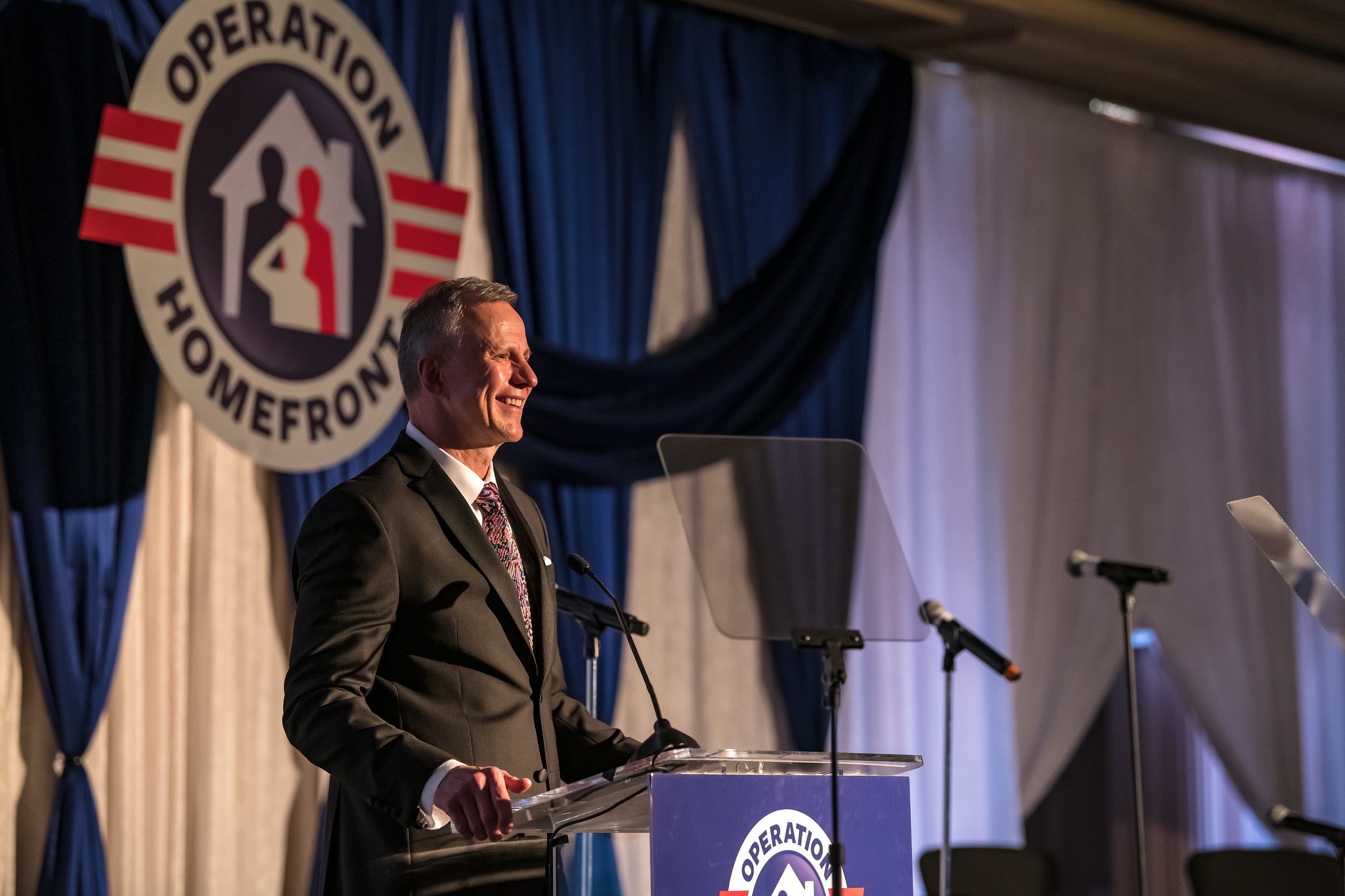CEO John Pray delivering speech at a MCOY Gala