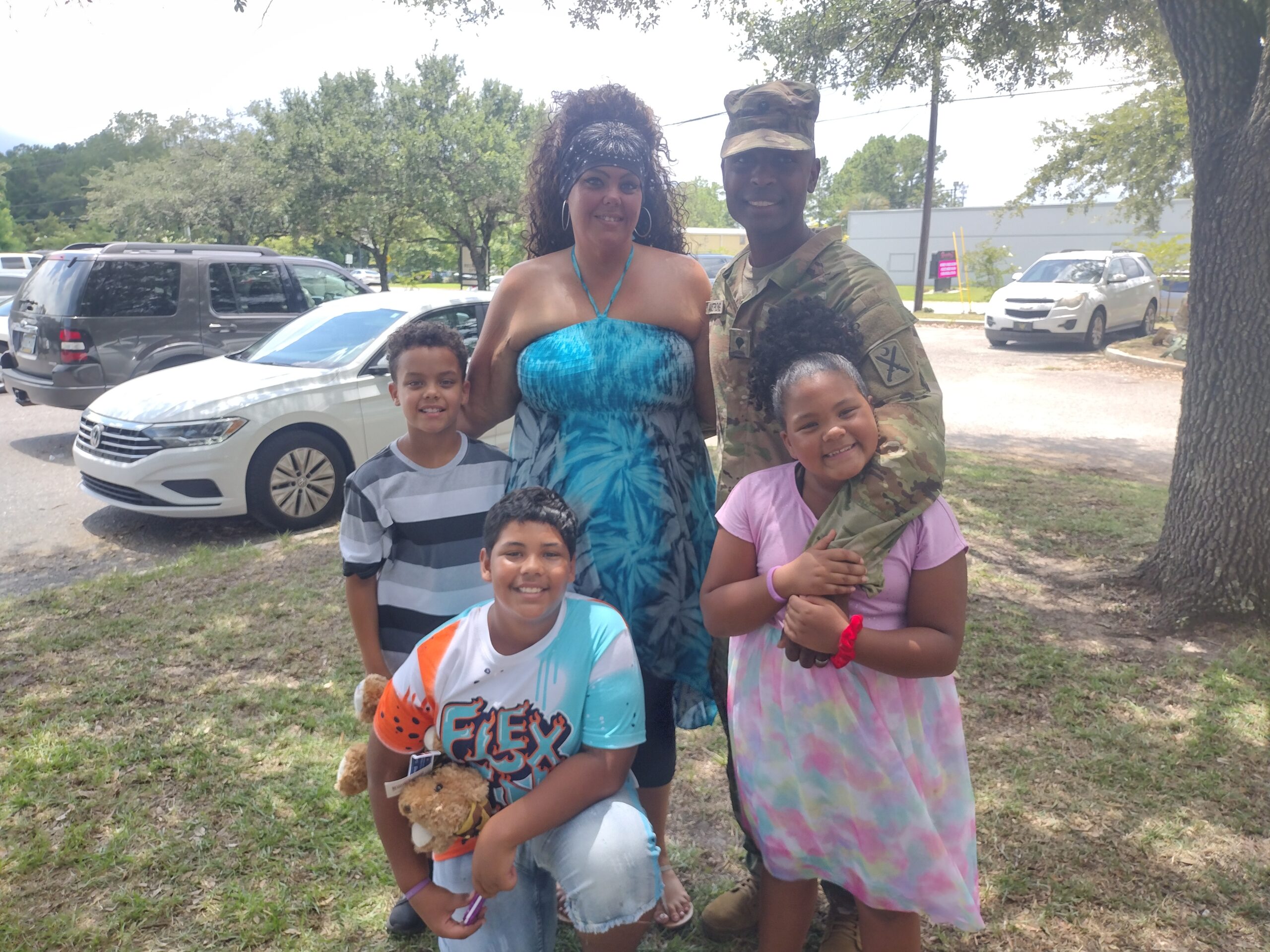 military family hugging and smiling