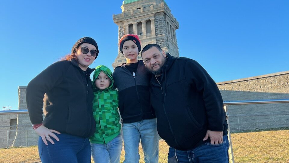 family hugging for photo