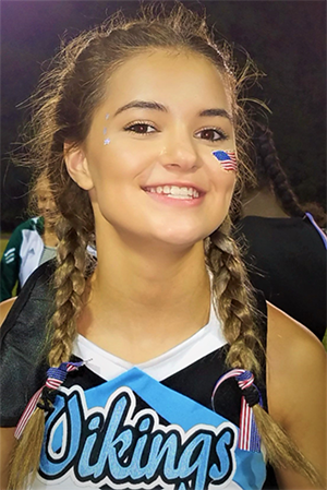 Fionnuala Mahoney smiling while in her cheer outfit